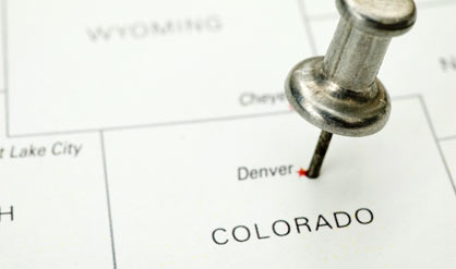 A push pin in a map of the Denver area