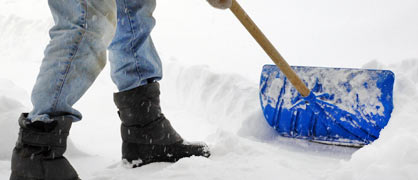 A man hand shoveling snow snow